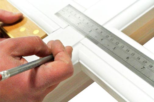 close up measuring a window
